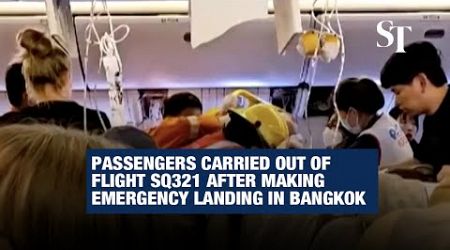 Passengers carried out of flight SQ321 after making emergency landing in Bangkok