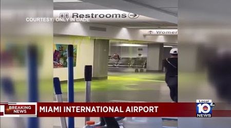 Fluorescent green liquid pours from ceiling at Miami International Airport