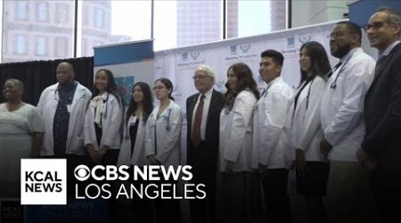 White coat ceremony ends with life-changing surprise for two medical students