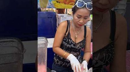 Friendly Lady Sells Fresh Fruit Smoothie At Local Market