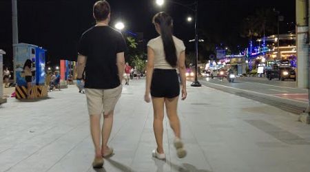 The European guy walking with his Thai girlfriend on Beach Road Pattaya. 2024