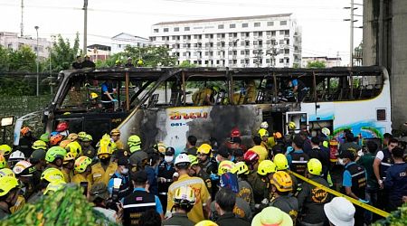 Thai police arrest driver, try to identify victims of school bus fire that killed 23 