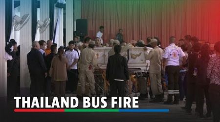 Relatives mourn as bodies from bus fire arrive at Thai temple