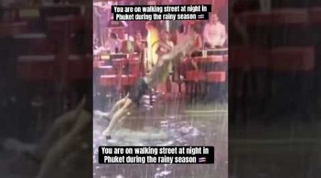 You are on walking street at night in Phuket during the rainy season 