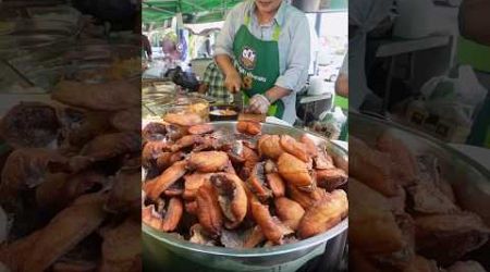 Rice Porridge with Fried Sun-Dried Tilapia Fish at Bangkok Street Food Thailand