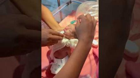 Newborn baby feeding with oxygen