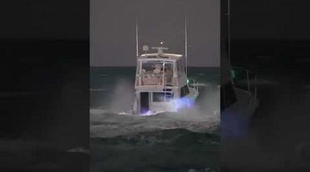 One of a kind night capture of luxury Viking fishing yacht at the Haulover Inlet