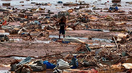 Angry residents of cyclone-hit Mayotte jeer Macron, plead for water