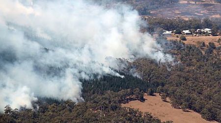 Out-of-control Australia bushfire will burn for days, officials say