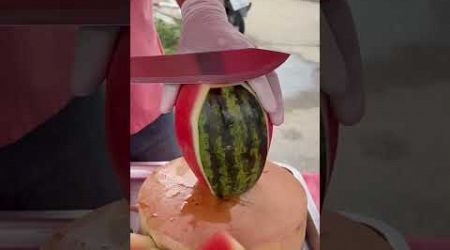 Fresh watermelon cutting with knife sharp - fruit cutting in Thailand