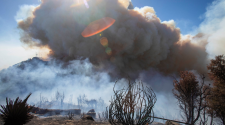 Los Angeles wildfires rage on even as fierce winds ebb