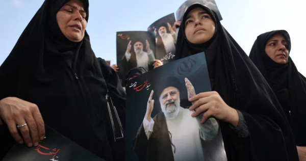 In divided Iran, president's death met by muted mourning and furtive celebration