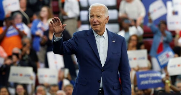 Democratic calls mount for Biden to end campaign, but he vows to fight on