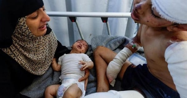 Young Gaza boy wounded and loses mother in Israeli airstrike