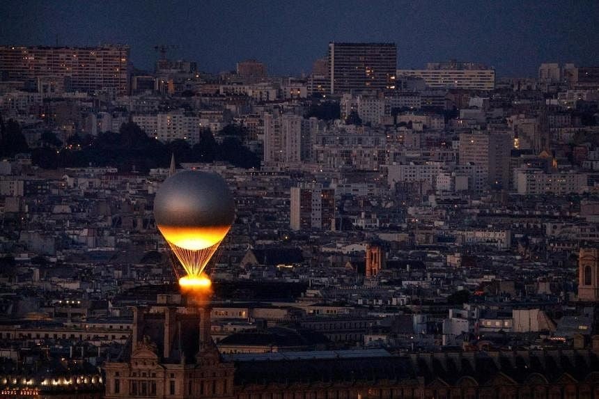 Paris mayor wants Olympic flame balloon to stay near Louvre after games end