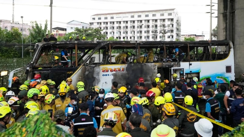 Thai police arrest driver, try to identify victims of school bus fire that killed 23 