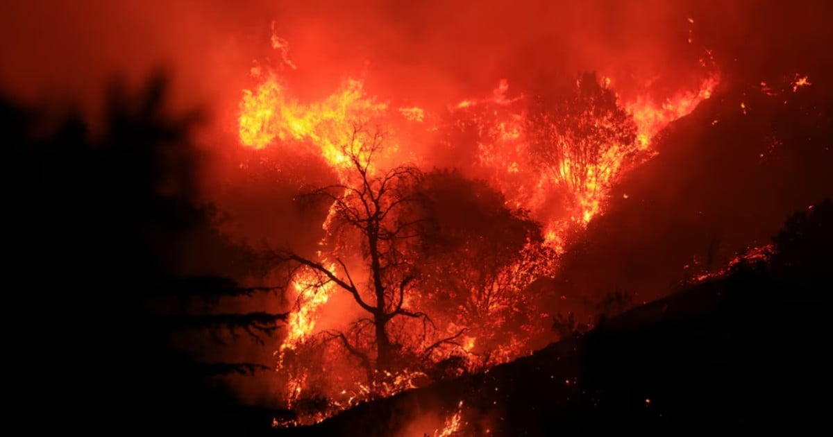 Thousands under evacuation near Los Angeles as wildfire torches homes